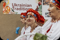 Festival guests in embroidered Ukrainian dress sharing a moment